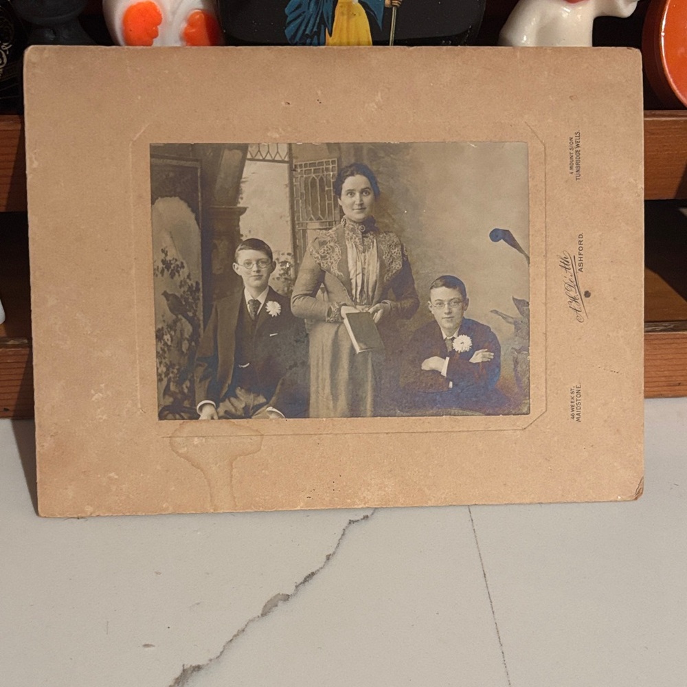 Antique photo of woman with book and two boys